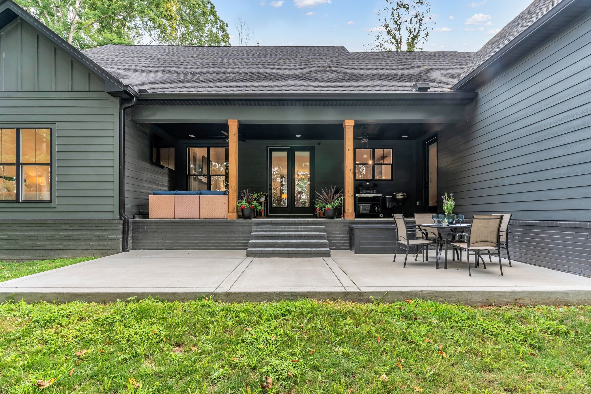 8921 Cedar Grove Road Cross Plains, TN 37049 - Photo 39 of 50 a view of a patio with table and chairs and potted plants
