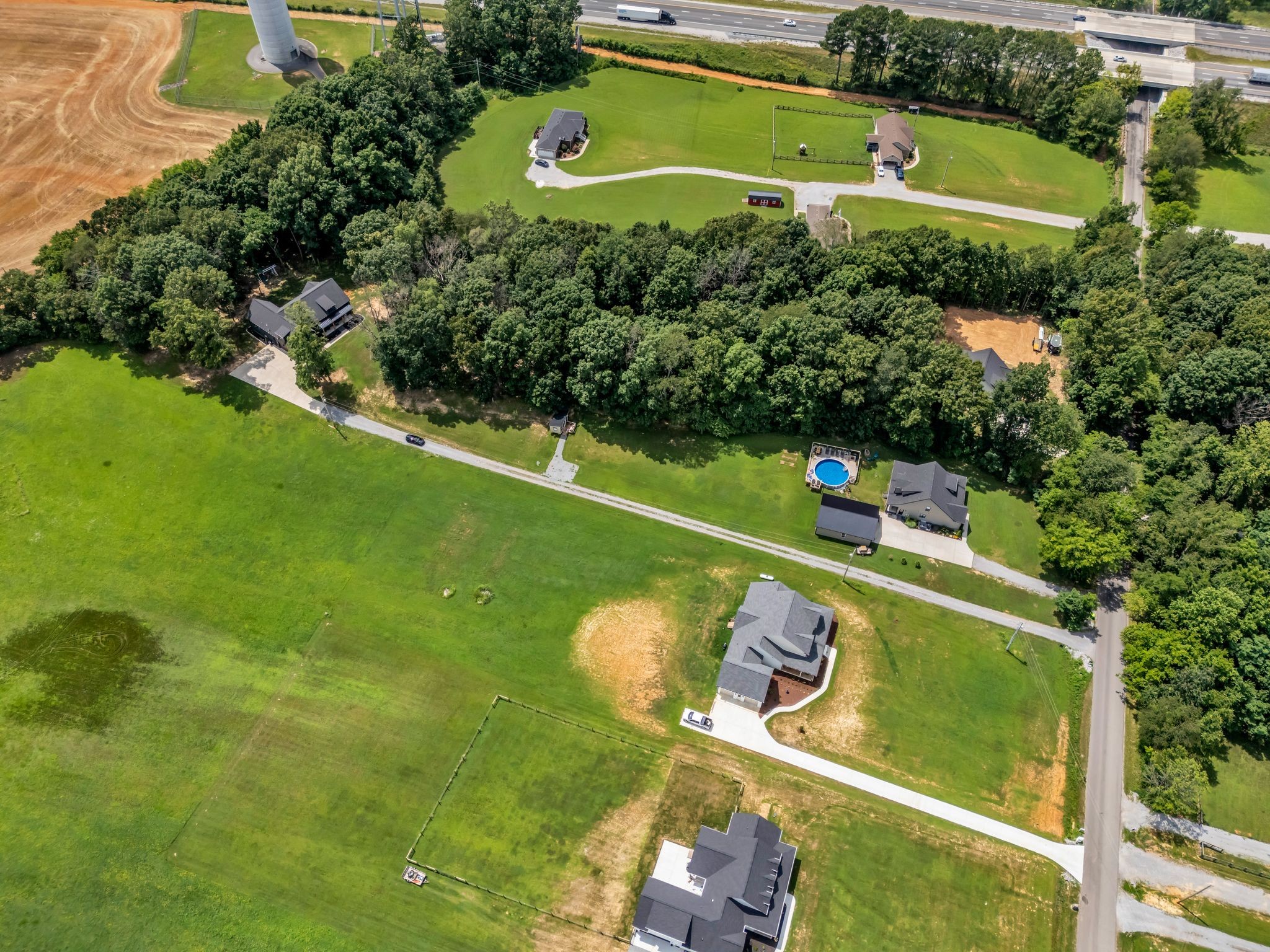 8921 Cedar Grove Road Cross Plains, TN 37049 - Photo 4 of 50 an aerial view of a golf course with a swimming pool