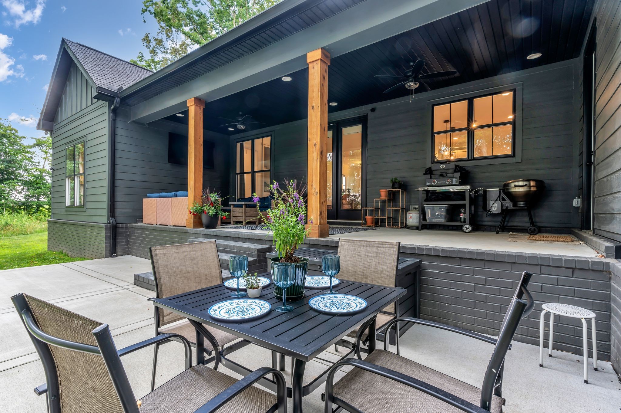 8921 Cedar Grove Road Cross Plains, TN 37049 - Photo 41 of 50 a view of a dining table and chairs in the patio