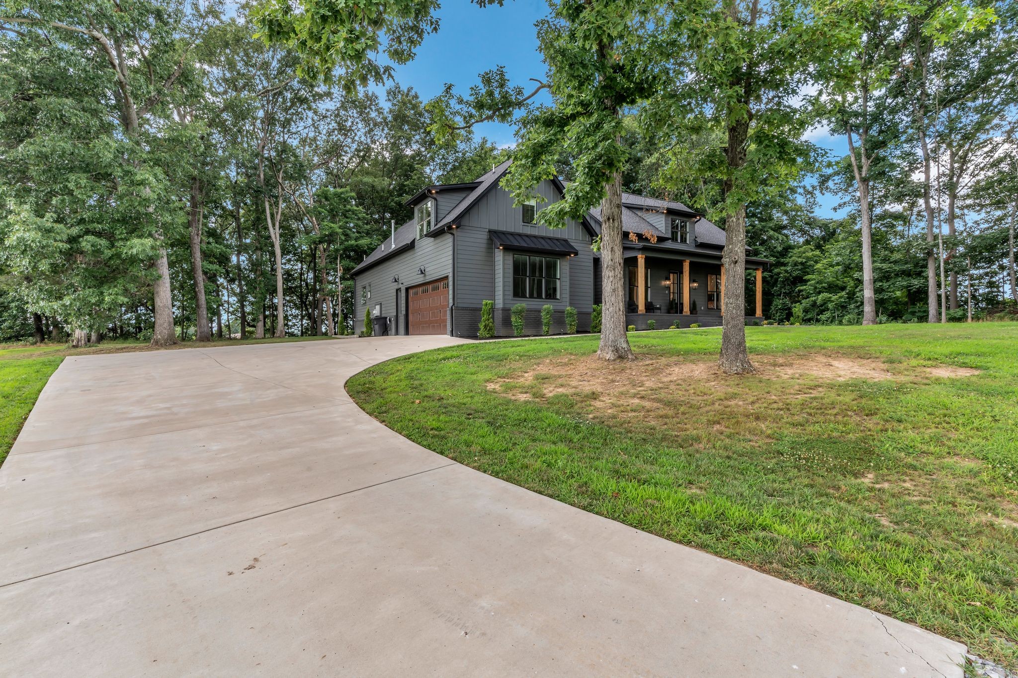 8921 Cedar Grove Road Cross Plains, TN 37049 - Photo 7 of 50 a house with trees in the background