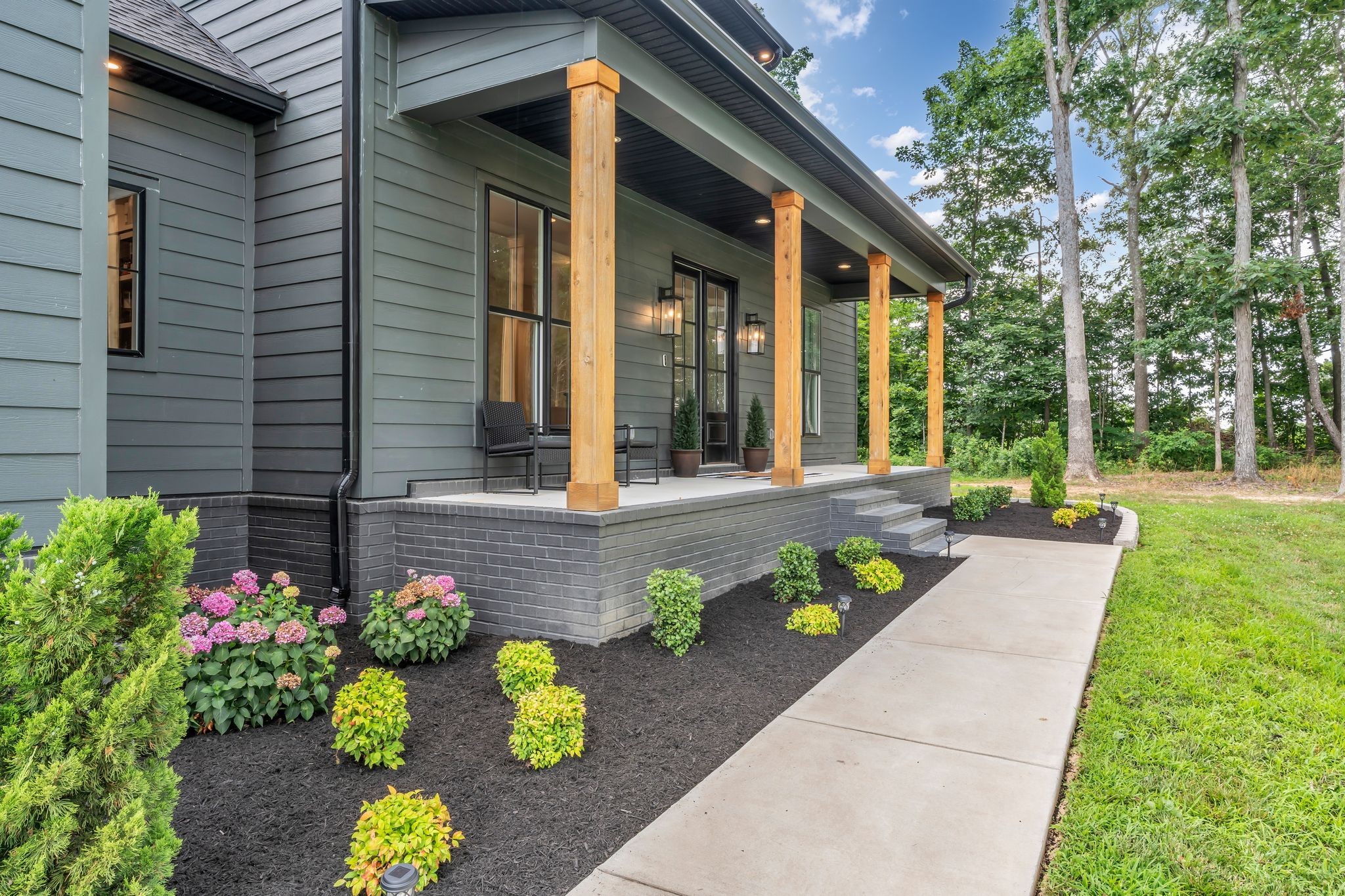 8921 Cedar Grove Road Cross Plains, TN 37049 - Photo 8 of 50 a front view of a house with a garden