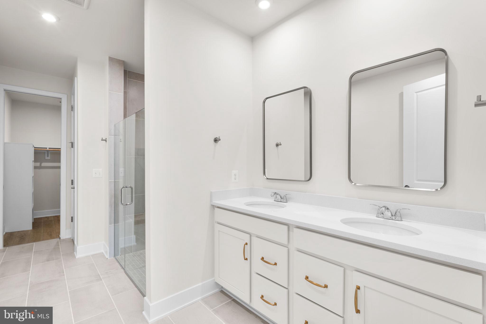 116 Keystone Lane Winchester, VA 22603 - Photo 24 of 42 a bathroom with double sink and a mirror