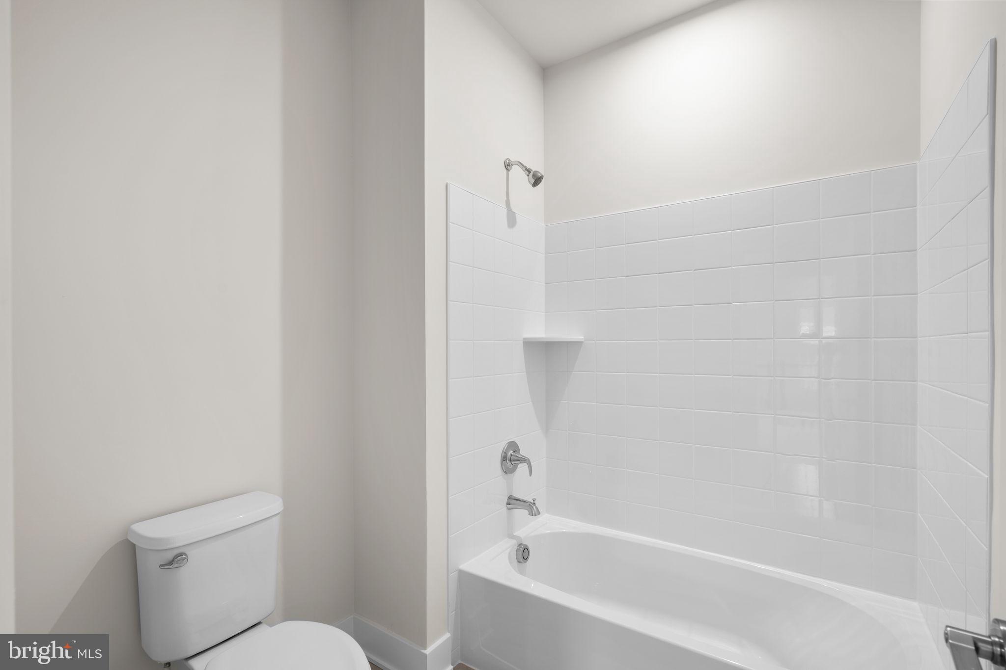 116 Keystone Lane Winchester, VA 22603 - Photo 31 of 42 a bathroom with a bathtub and a toilet