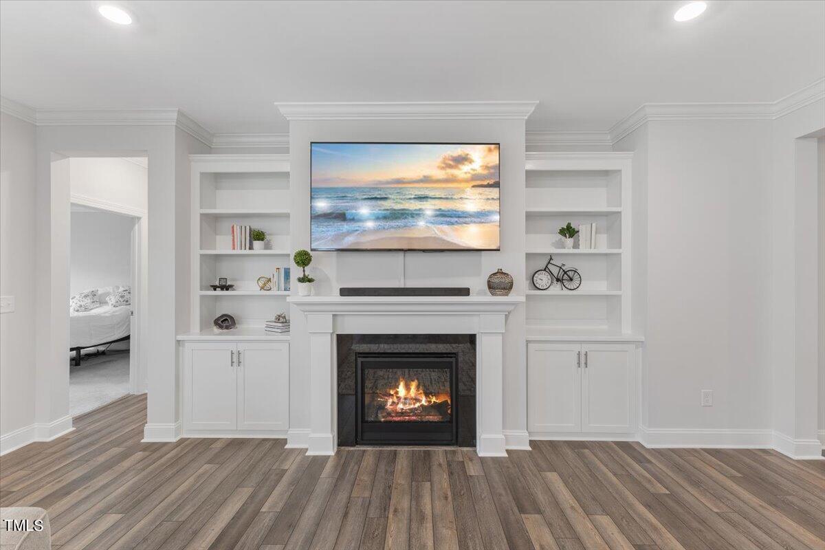 213 Mahogany Run Raleigh, NC 27610 - Photo 11 of 40 a living room with furniture and a fireplace