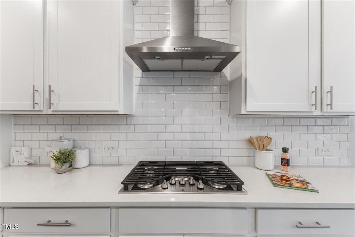 213 Mahogany Run Raleigh, NC 27610 - Photo 15 of 40 a kitchen with a stove and cabinets