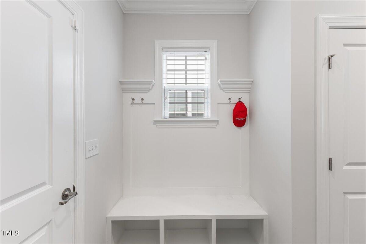 213 Mahogany Run Raleigh, NC 27610 - Photo 21 of 40 a room with window and a white wooden door