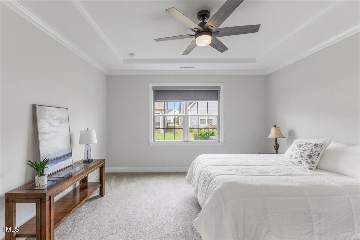213 Mahogany Run Raleigh, NC 27610 - Photo 22 of 40 a bedroom with a bed and a window