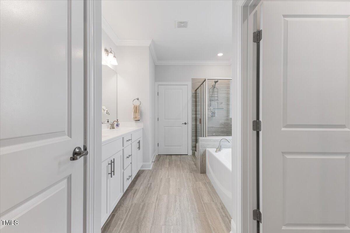 213 Mahogany Run Raleigh, NC 27610 - Photo 26 of 40 a bathroom with a bathtub and a shower