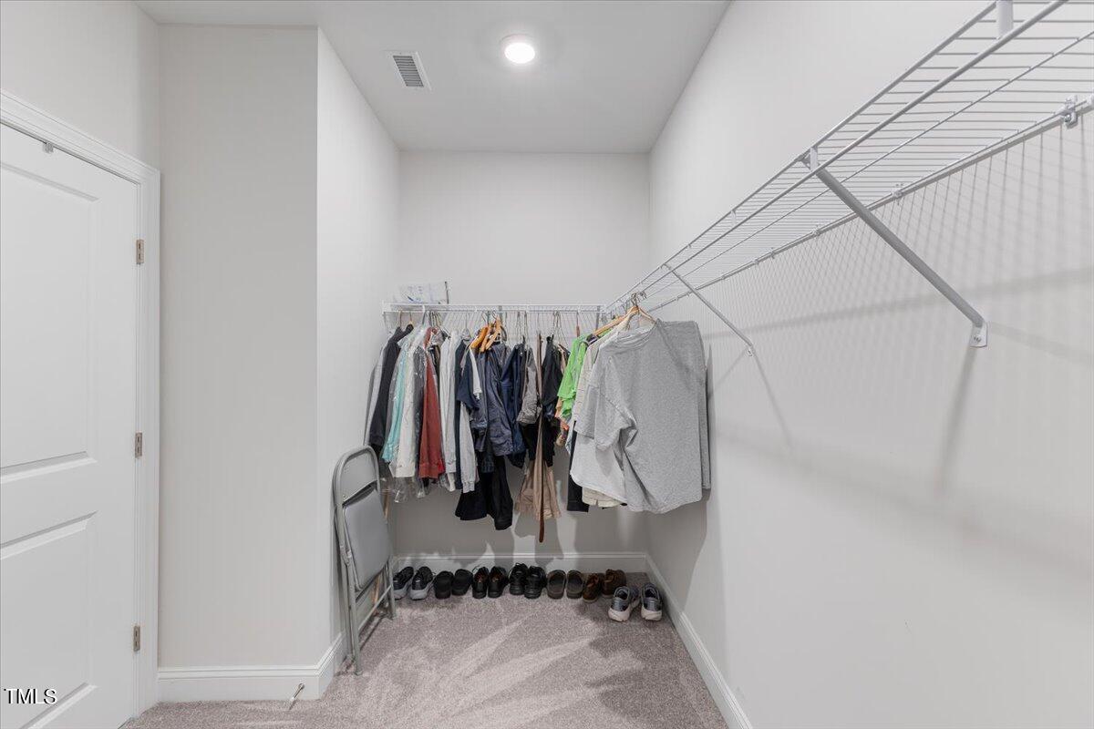 213 Mahogany Run Raleigh, NC 27610 - Photo 27 of 40 a view of walk in closet with clothes