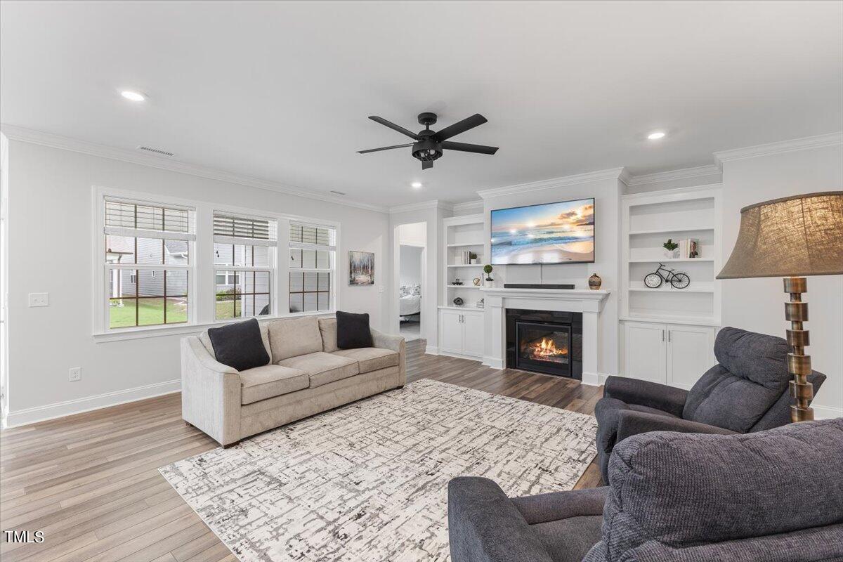213 Mahogany Run Raleigh, NC 27610 - Photo 10 of 40 a living room with furniture and a fireplace