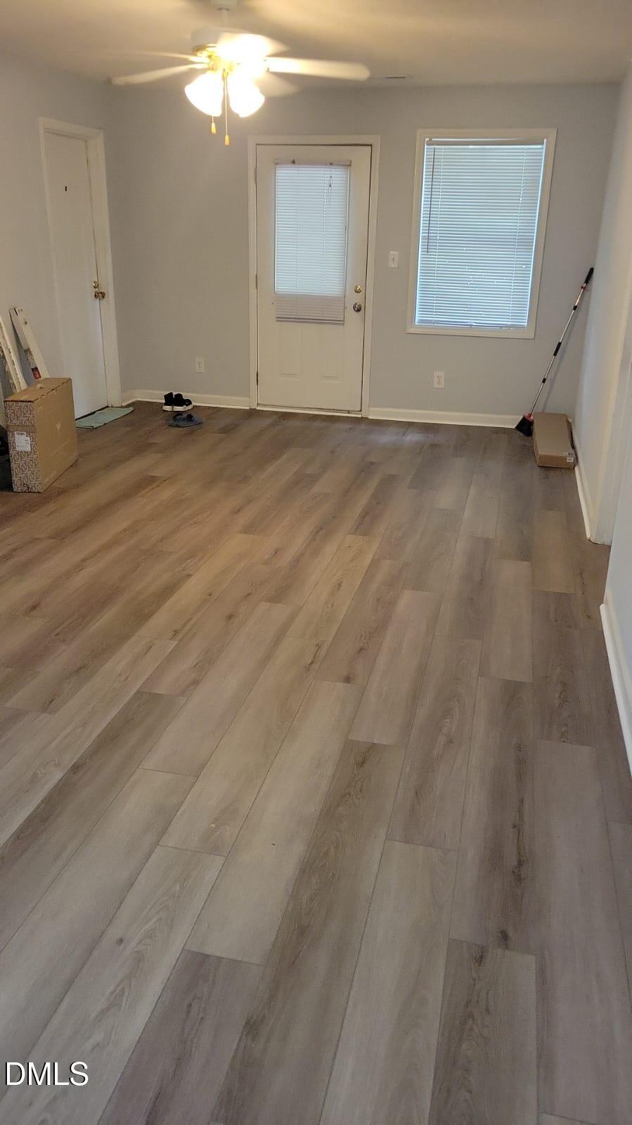 1110 Carlton Avenue, Unit 204 Raleigh, NC 27606 - Photo 2 of 12 an empty room with windows