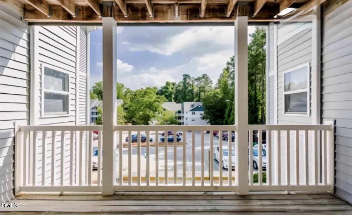 1110 Carlton Avenue, Unit 204 Raleigh, NC 27606 - Photo 4 of 12 a view of a wooden deck