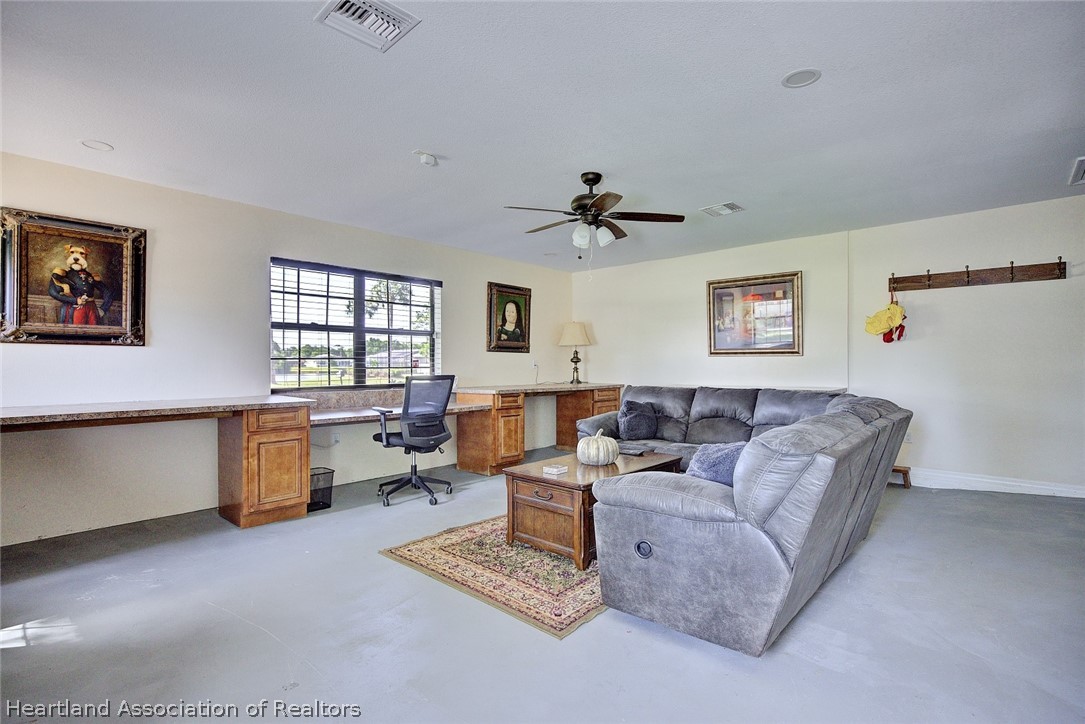 3601 Divot Road Sebring, FL 33872 - Photo 14 of 31 a living room with furniture and window