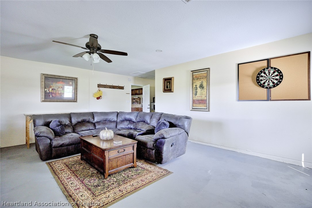3601 Divot Road Sebring, FL 33872 - Photo 15 of 31 a living room with furniture and a window