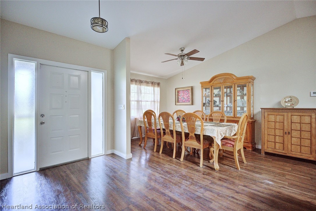 3601 Divot Road Sebring, FL 33872 - Photo 21 of 31 a view of a dining room with furniture window and wooden floor