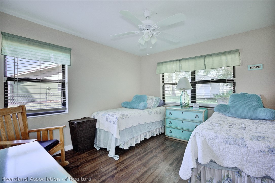3601 Divot Road Sebring, FL 33872 - Photo 25 of 31 a bedroom with a bed and windows