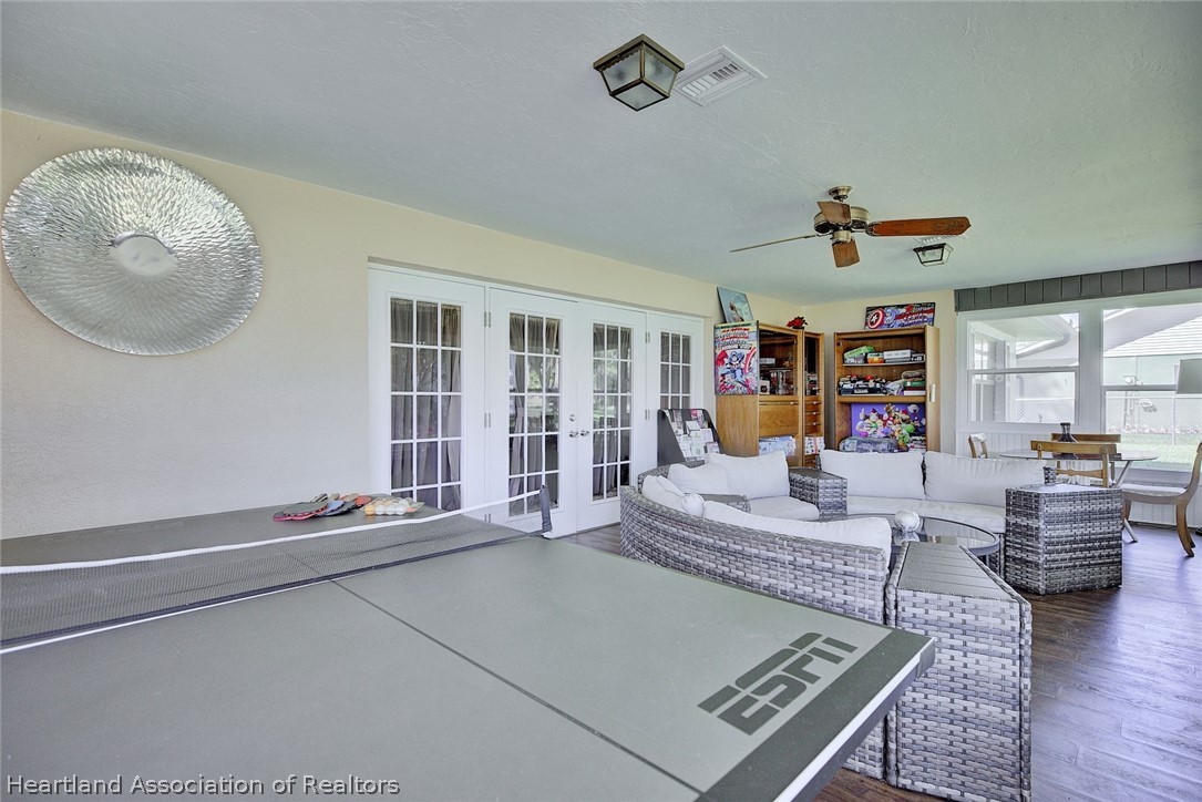 3601 Divot Road Sebring, FL 33872 - Photo 30 of 31 a living room with furniture and a rug