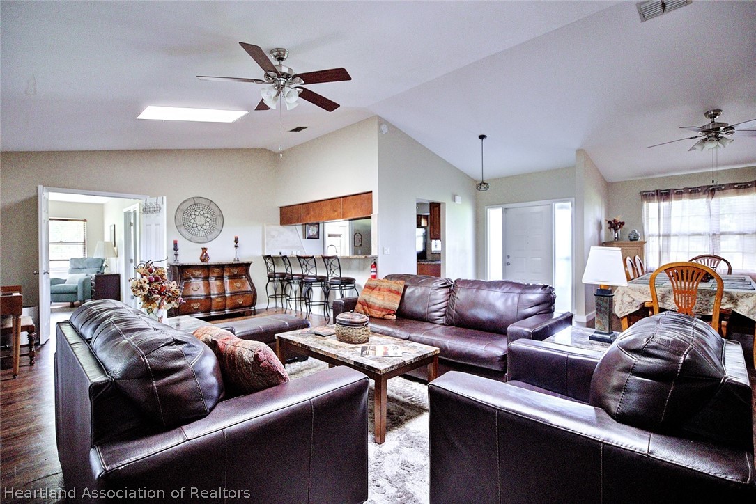 3601 Divot Road Sebring, FL 33872 - Photo 8 of 31 a living room with furniture fireplace and a window