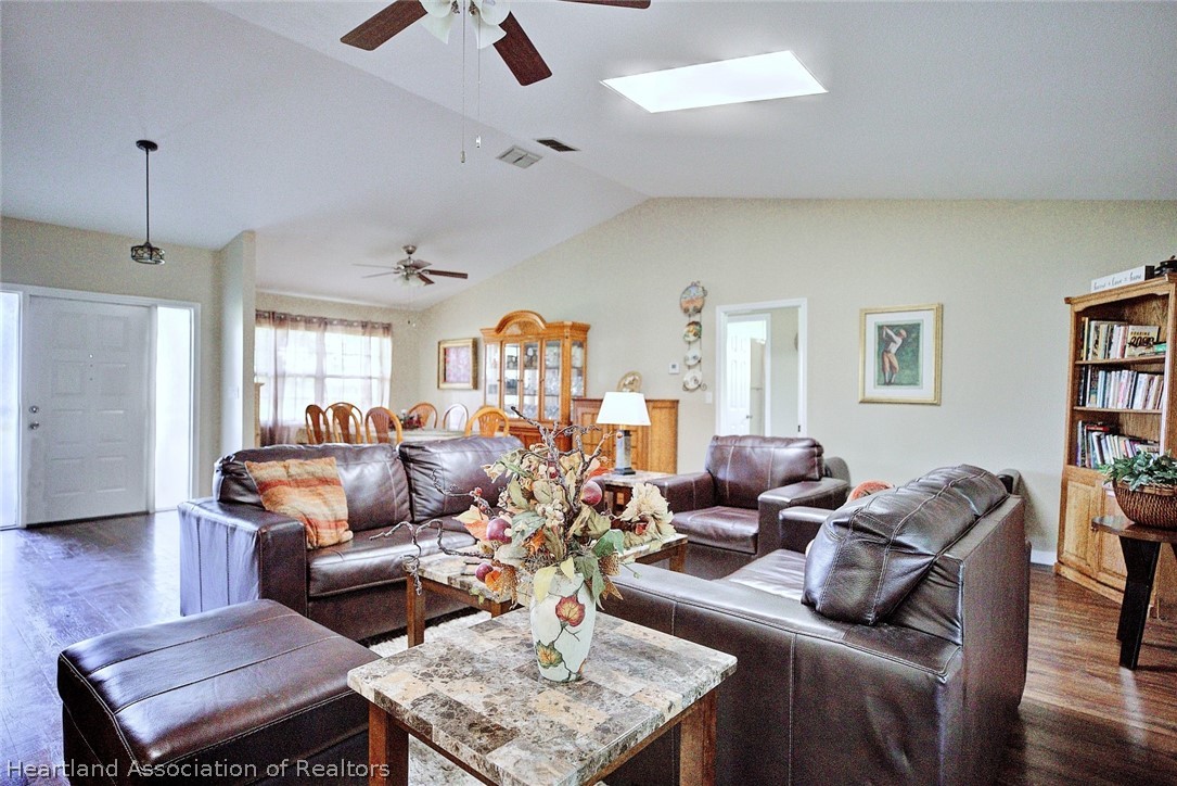 3601 Divot Road Sebring, FL 33872 - Photo 10 of 31 a living room with furniture or couch and a wooden floor