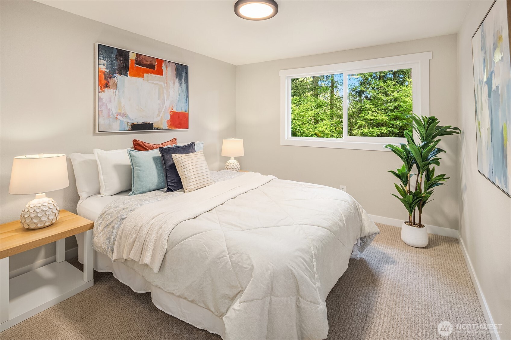 16914 28th Drive Southeast Bothell, WA 98012 - Photo 16 of 30 a bedroom with a bed and a potted plant