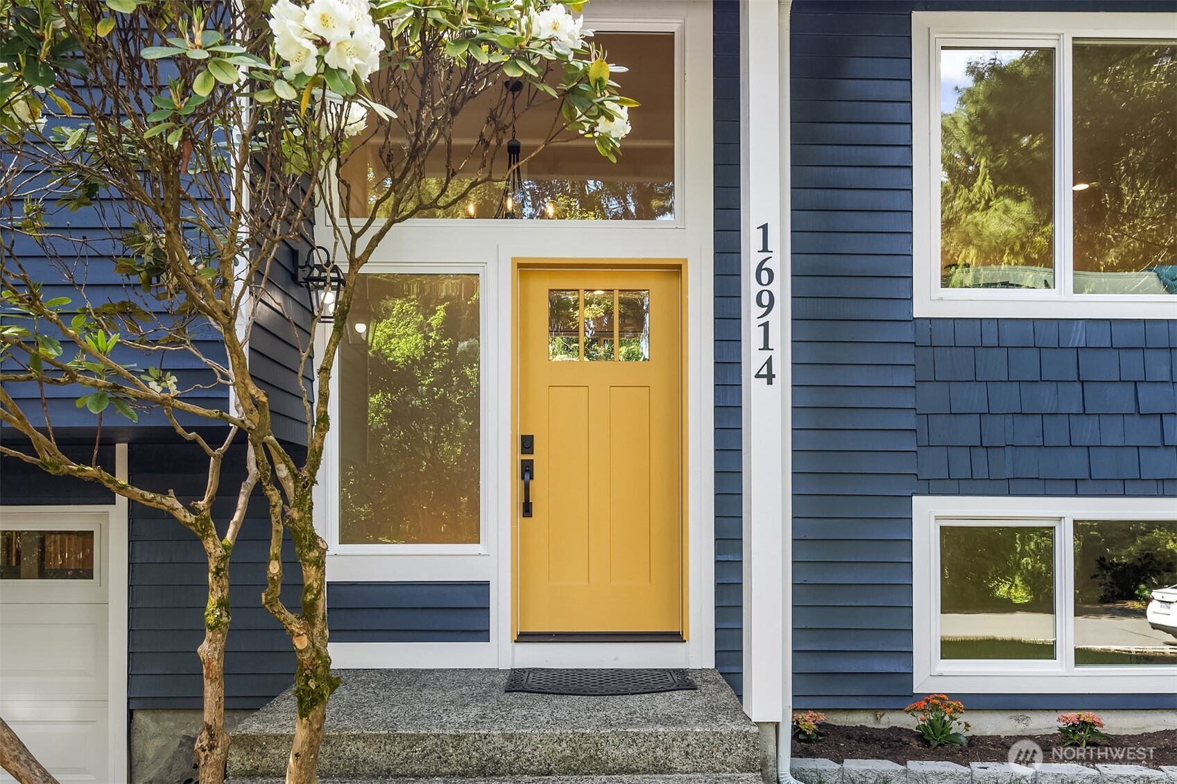 16914 28th Drive Southeast Bothell, WA 98012 - Photo 2 of 30 a sign on the side of a building