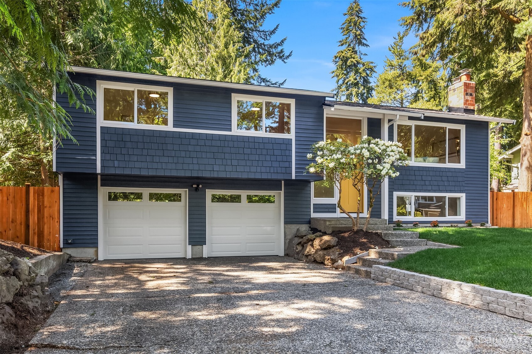 16914 28th Drive Southeast Bothell, WA 98012 - Photo 27 of 30 a front view of a house with a yard and garage