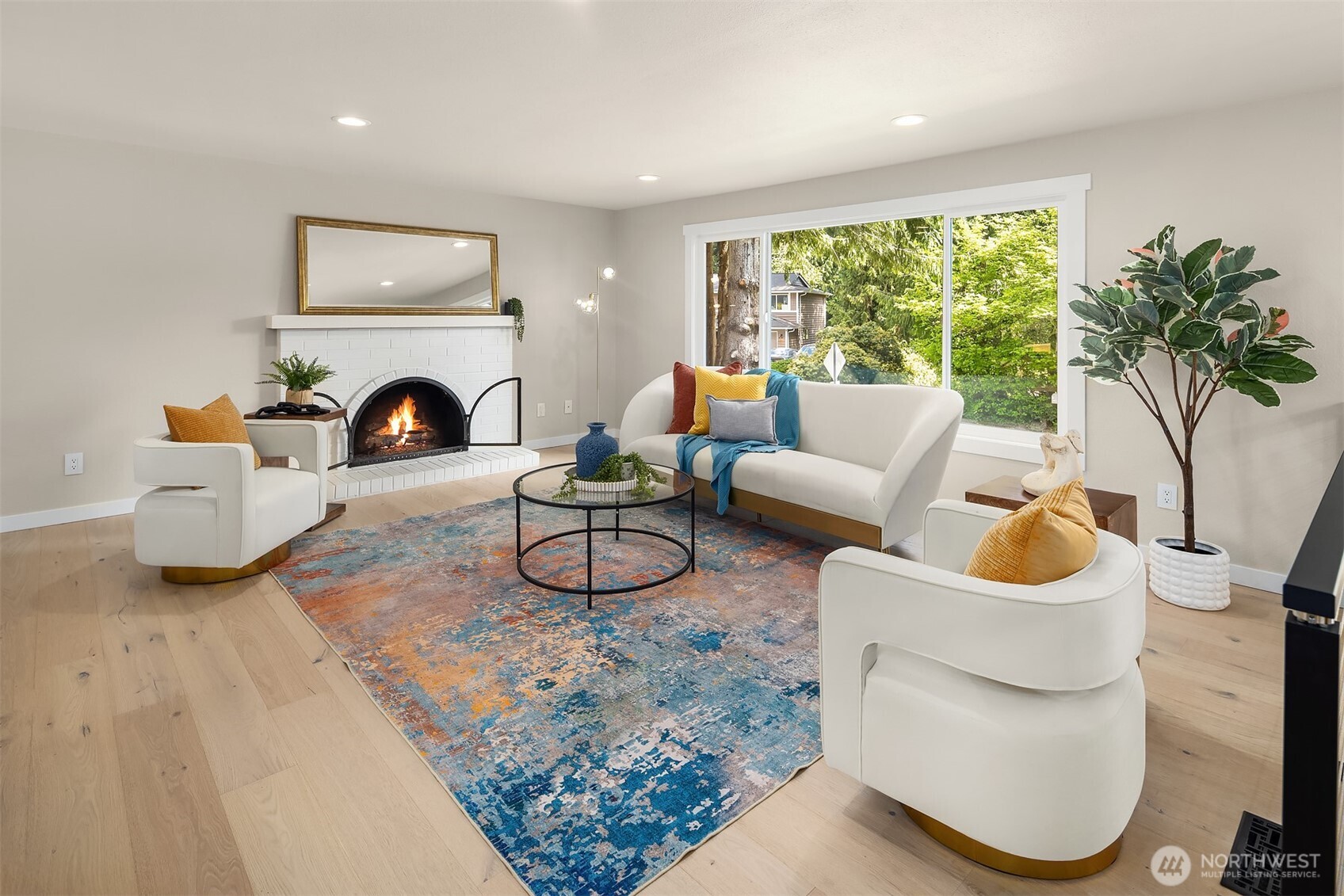 16914 28th Drive Southeast Bothell, WA 98012 - Photo 4 of 30 a living room with furniture a fireplace and a large window