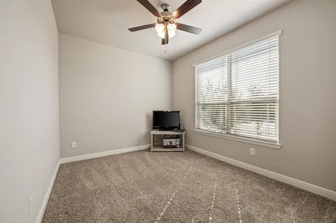 a view of livingroom with hardwood floor and ceiling fan
