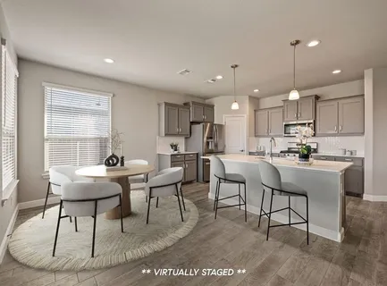 a view of kitchen with dining table and chairs