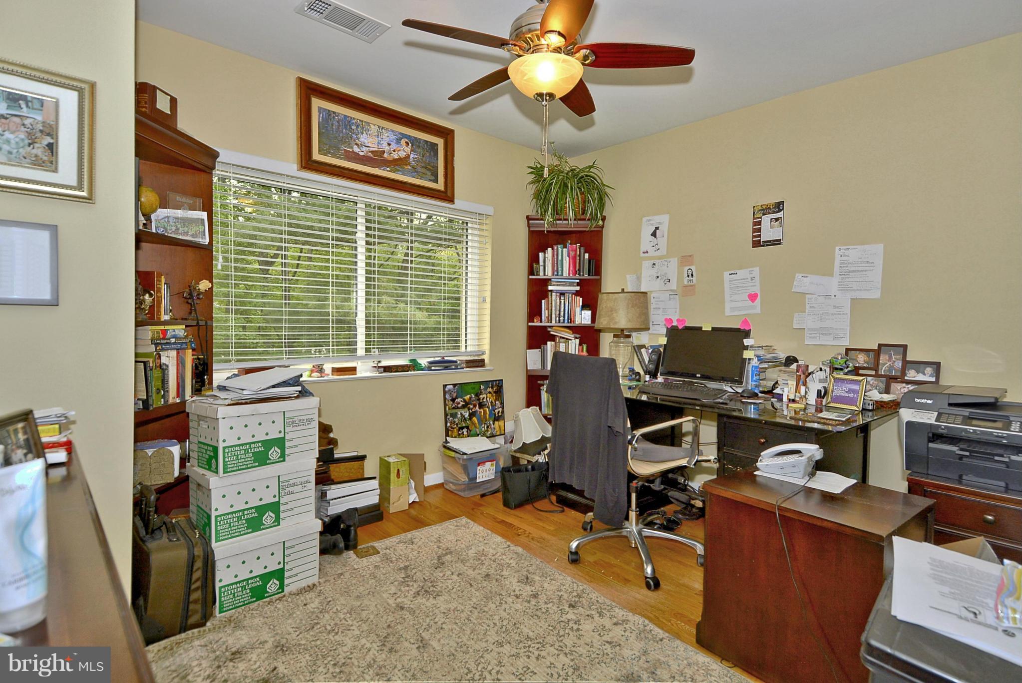 1601 Inlet Court Reston, VA 20190 - Photo 13 of 29 a view of a workspace with furniture and a window