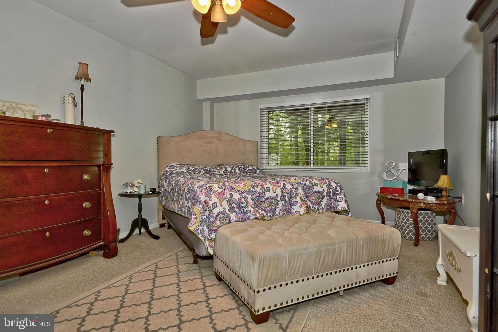 1601 Inlet Court Reston, VA 20190 - Photo 18 of 29 a bedroom with a bed and a flat tv screen