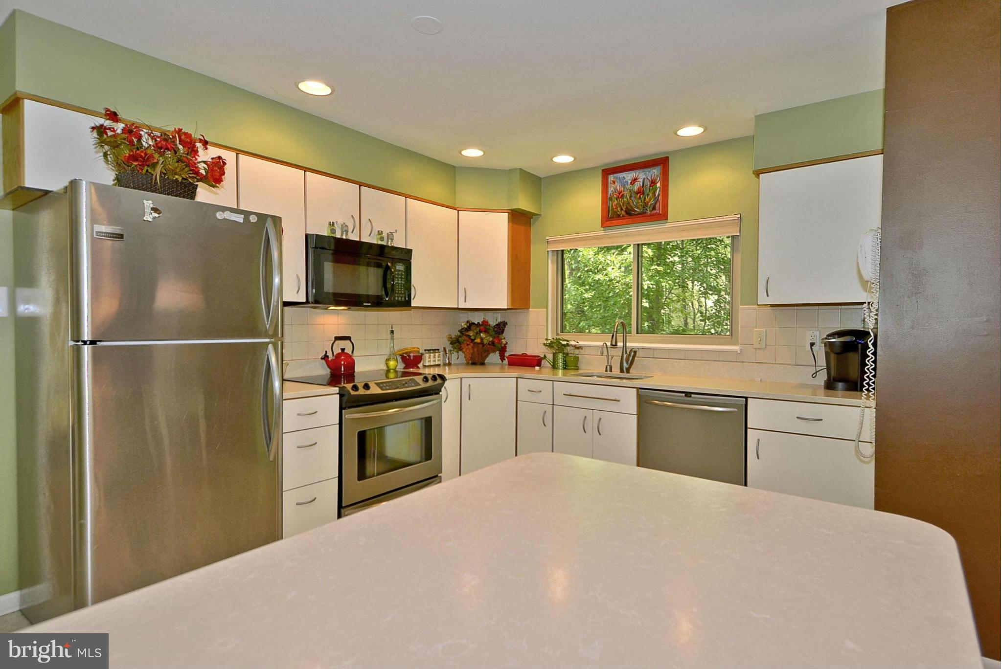 1601 Inlet Court Reston, VA 20190 - Photo 5 of 29 a kitchen with a refrigerator and a stove top oven