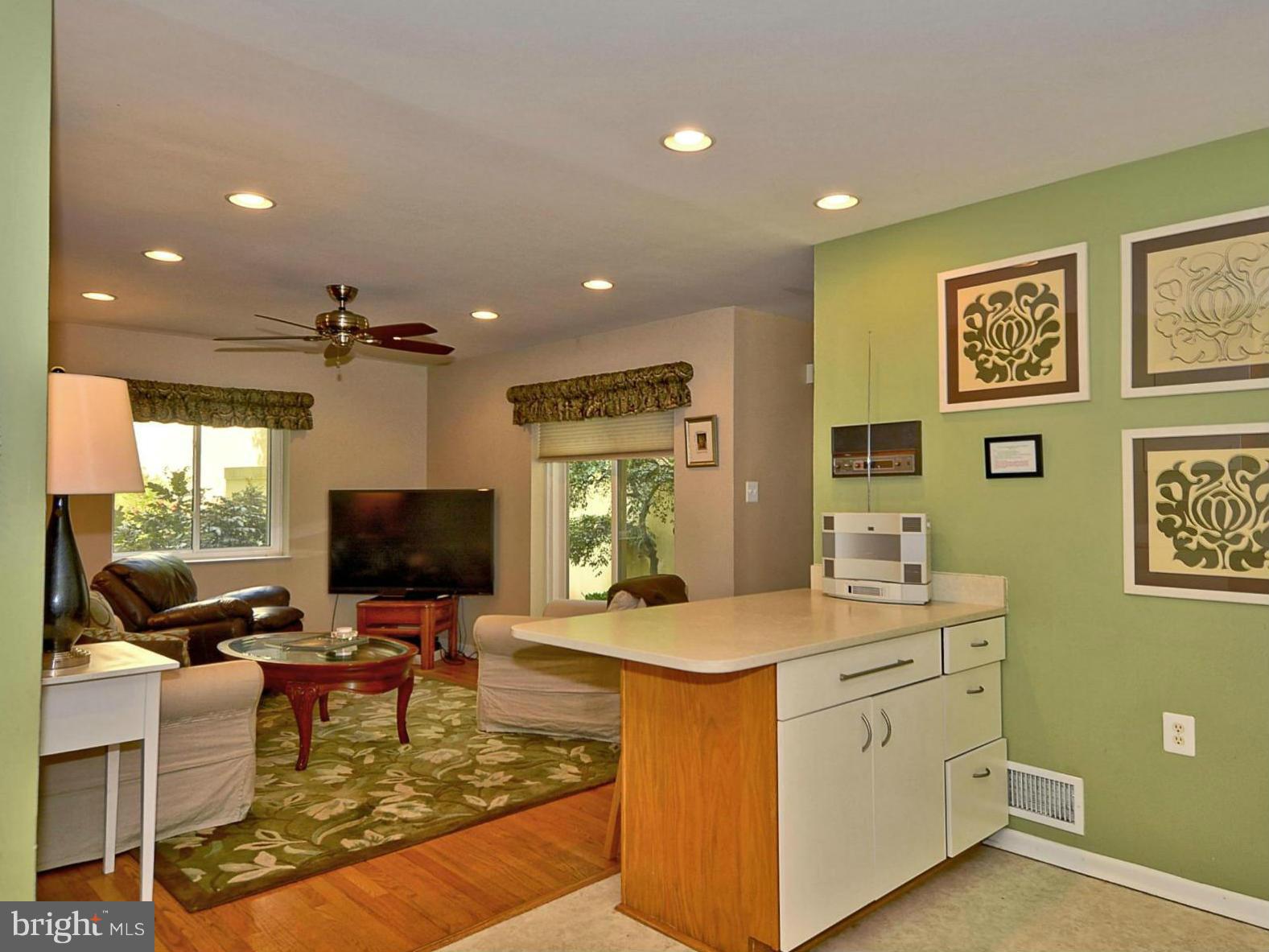 1601 Inlet Court Reston, VA 20190 - Photo 6 of 29 a living room with furniture and a flat screen tv