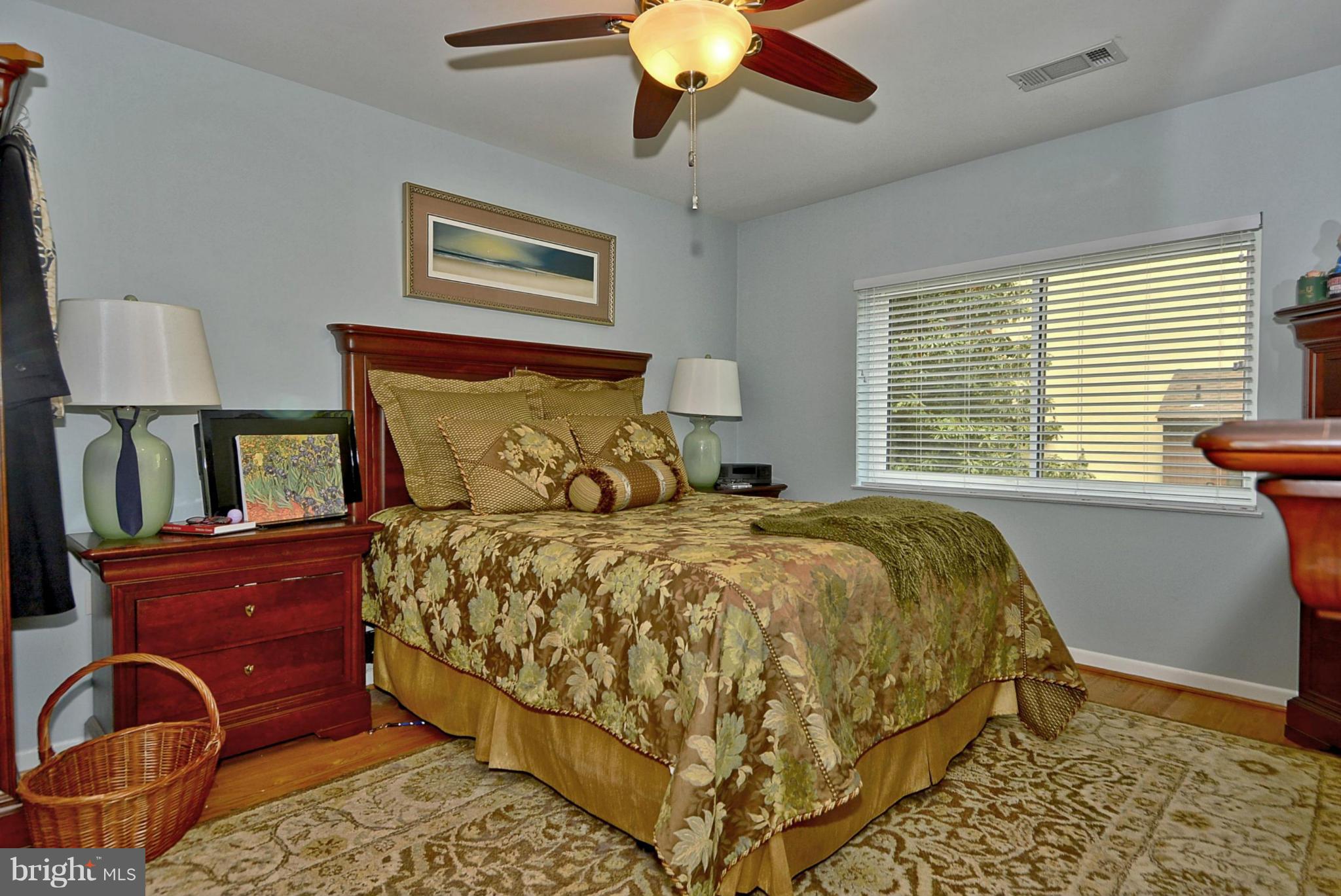 1601 Inlet Court Reston, VA 20190 - Photo 9 of 29 a bed sitting in a bedroom next to a window
