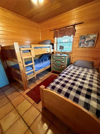 a bedroom with furniture and window