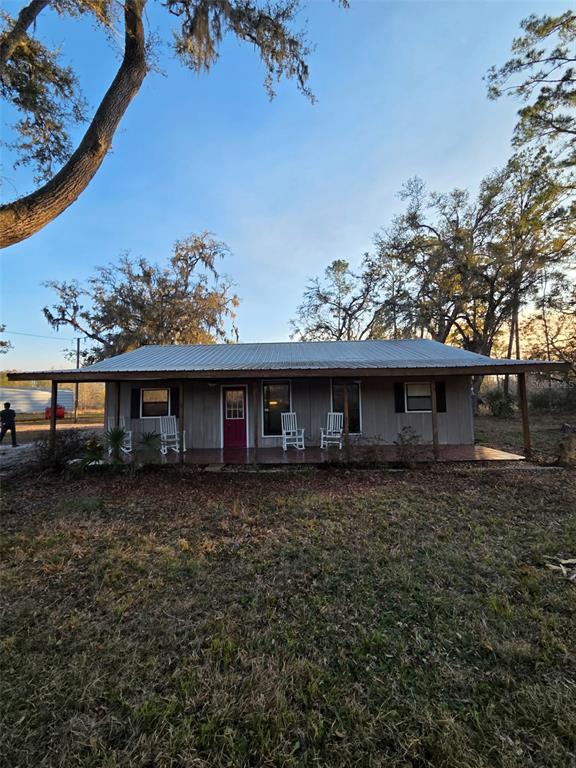 1106 Fox Hunter S Road Perry, FL 32348 - Photo 3 of 23 a front view of a house with garden