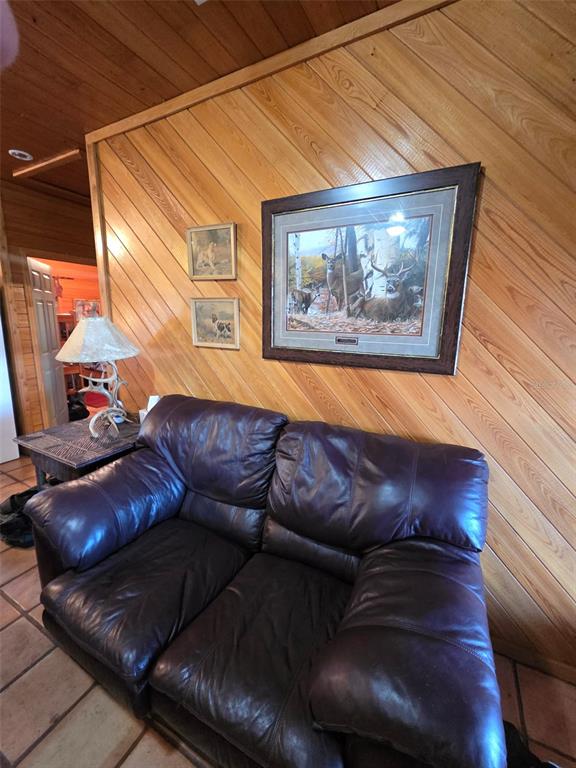 1106 Fox Hunter S Road Perry, FL 32348 - Photo 5 of 23 a living room with furniture and a wooden floor