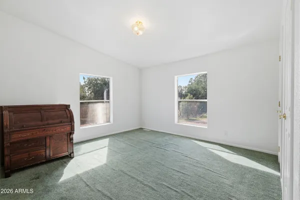 a view of room with window and cabinet