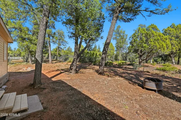 a view of a tree in front of a house