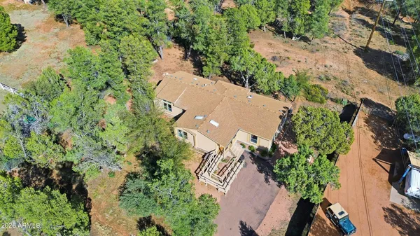 an aerial view of a house with a yard