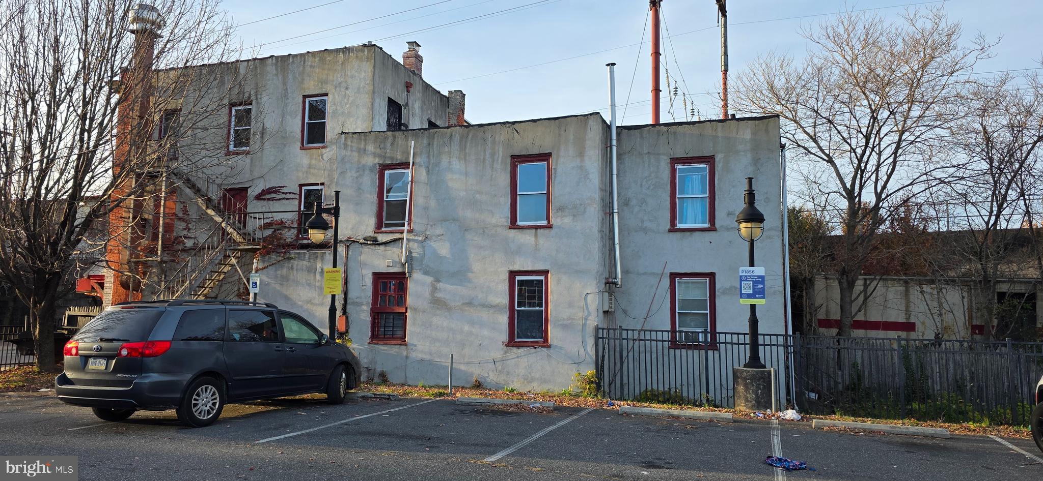 525 Welsh Street Chester, PA 19013 - Photo 2 of 4 a car parked in front of a building