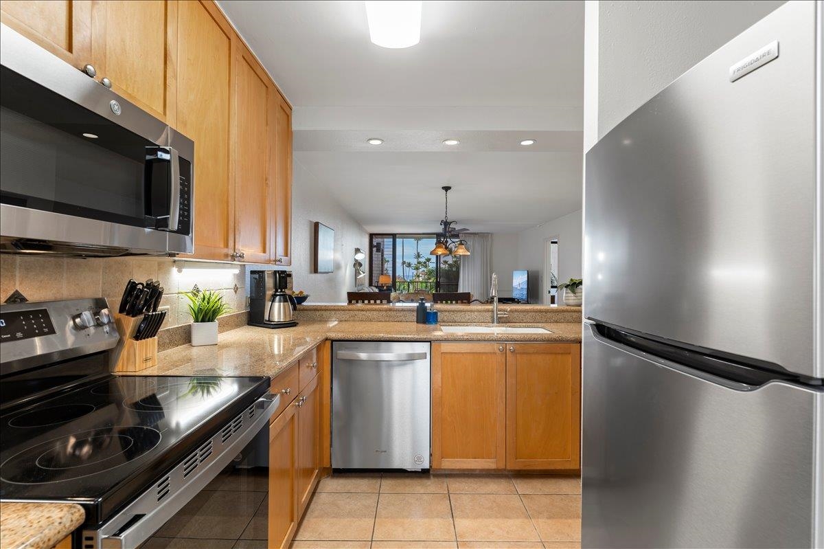 2695 South Kihei Road, Unit 5205 Kihei, HI 96753 - Photo 11 of 43 a kitchen with a sink appliances and cabinets