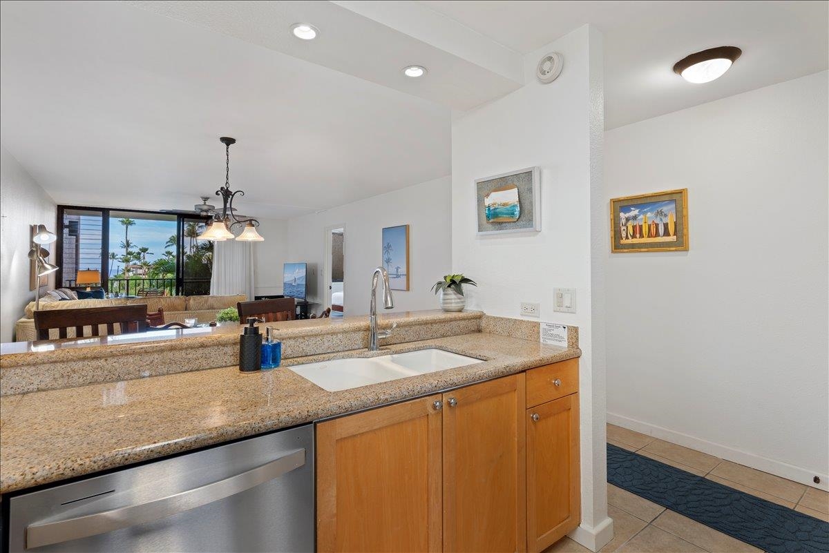 2695 South Kihei Road, Unit 5205 Kihei, HI 96753 - Photo 15 of 43 a kitchen with a sink and a refrigerator