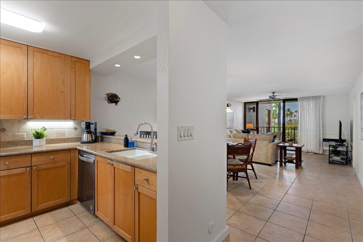 2695 South Kihei Road, Unit 5205 Kihei, HI 96753 - Photo 16 of 43 a kitchen with a sink and cabinets