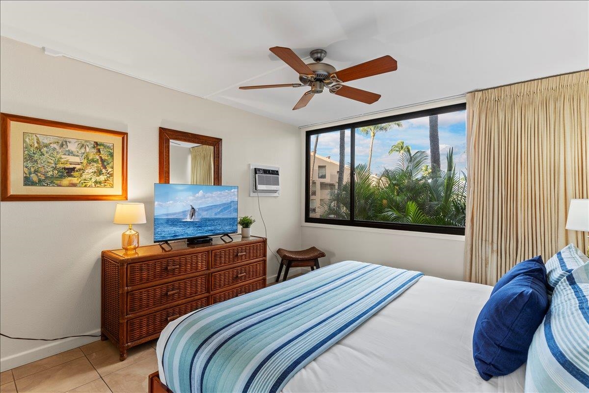 2695 South Kihei Road, Unit 5205 Kihei, HI 96753 - Photo 28 of 43 a bedroom with a bed and a window