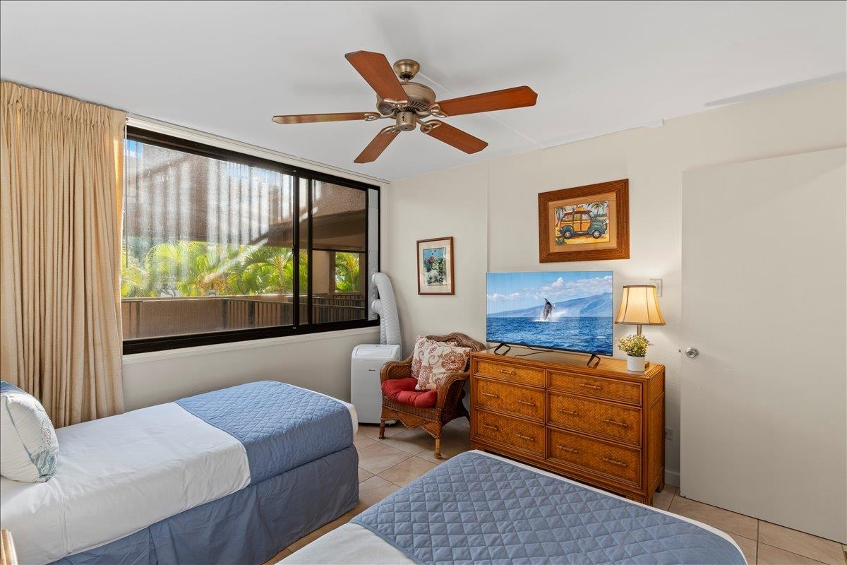 2695 South Kihei Road, Unit 5205 Kihei, HI 96753 - Photo 33 of 43 a bedroom with furniture and a large window