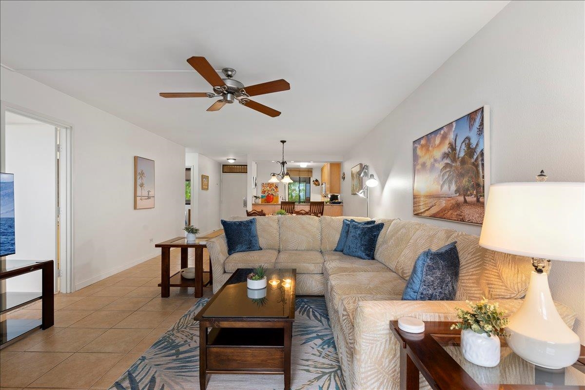 2695 South Kihei Road, Unit 5205 Kihei, HI 96753 - Photo 5 of 43 a living room with furniture and a wooden floor