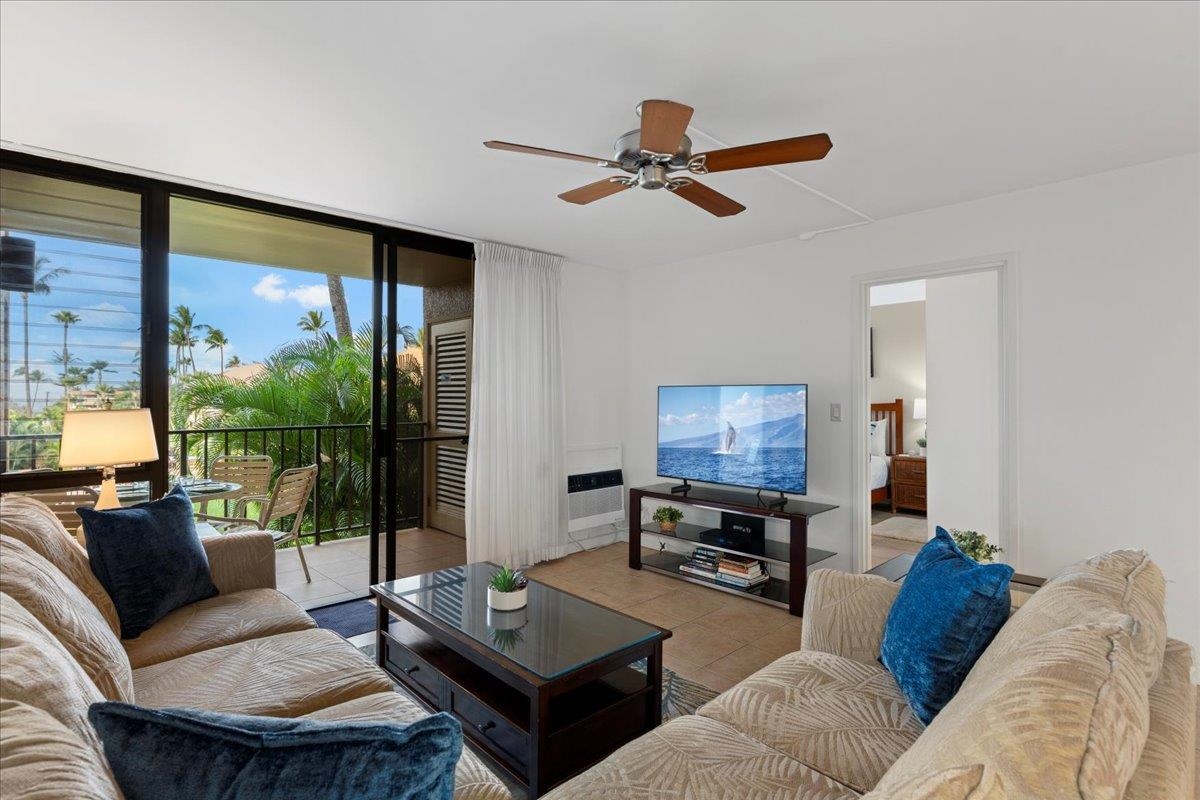 2695 South Kihei Road, Unit 5205 Kihei, HI 96753 - Photo 8 of 43 a living room with furniture and a large window
