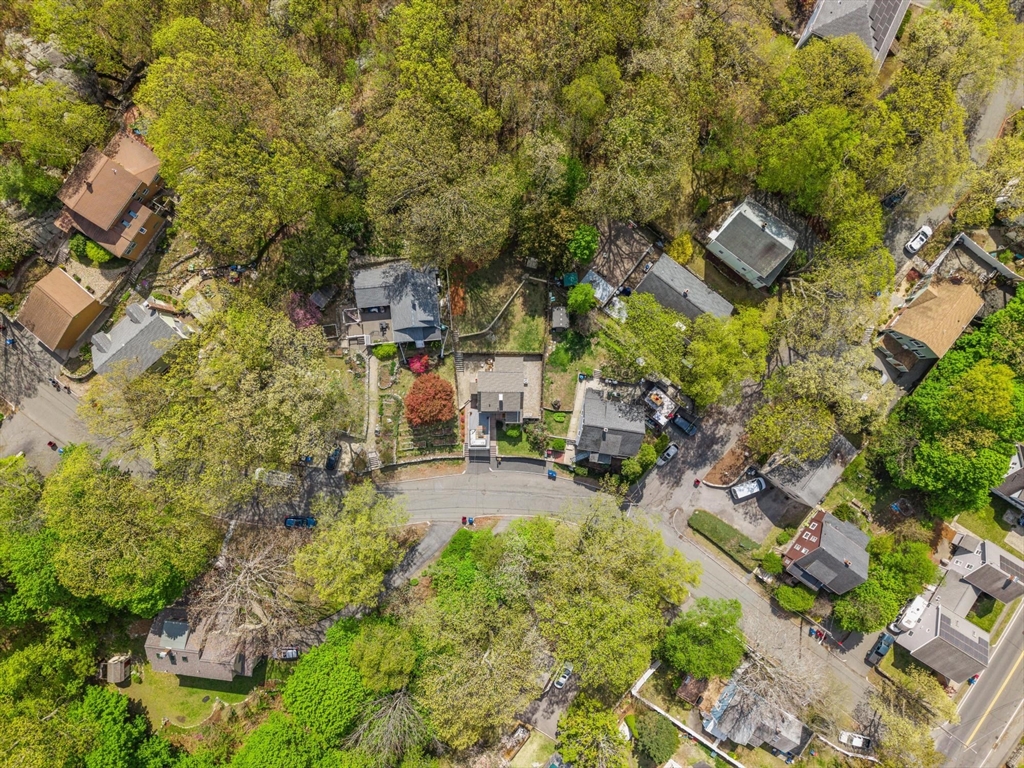25 Naples Road Melrose, MA 02176 - Photo 35 of 36 a backyard of a house with yard and outdoor seating