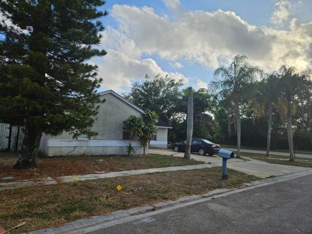 5454 River Plantation Road Lake Worth, FL 33463 - Photo 3 of 3 a backyard of a house with portable swimming pool and basket ball court